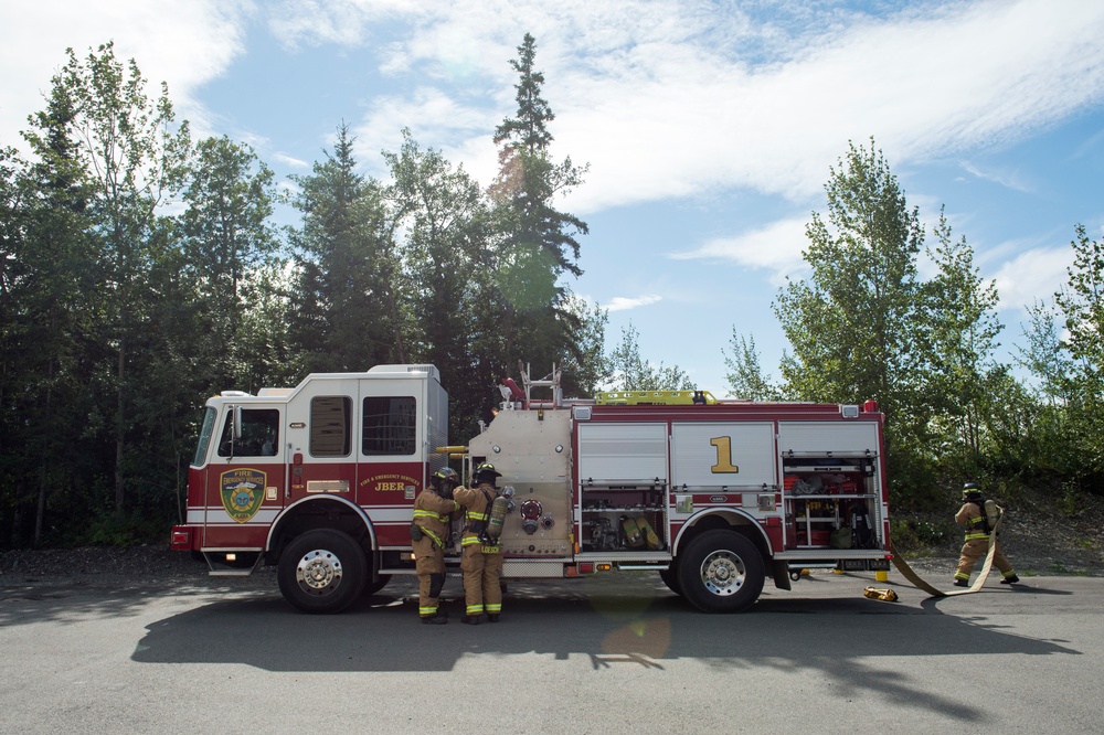 Air Force firefighters conduct wartime-firefighting readiness training at JBER Air Force firefighters conduct wartime-firefighting readiness training at JBER