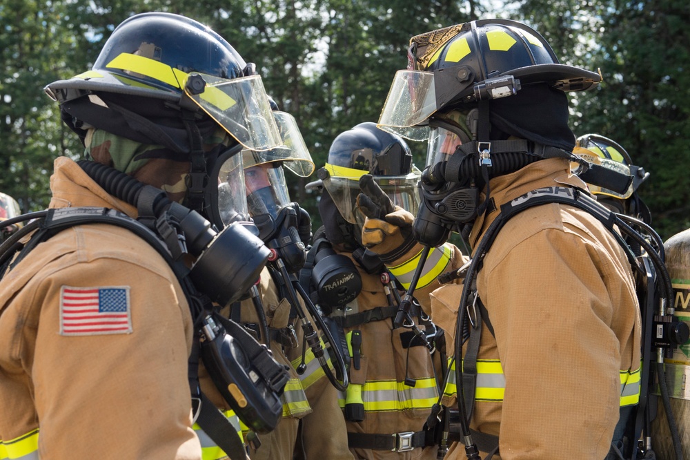 Air Force firefighters conduct wartime-firefighting readiness training at JBER Air Force firefighters conduct wartime-firefighting readiness training at JBER