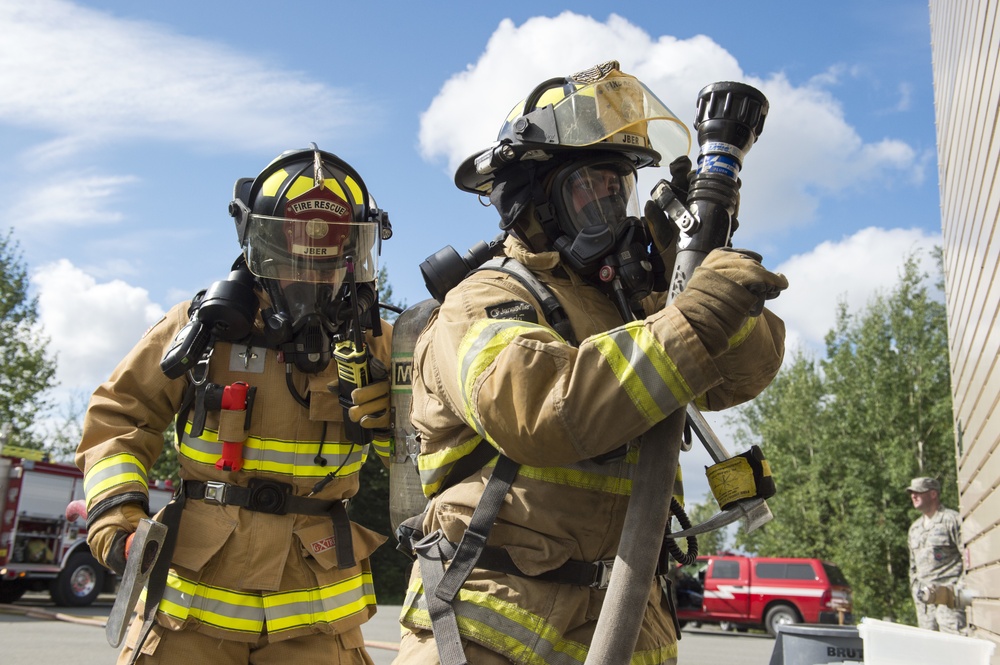Air Force firefighters conduct wartime-firefighting readiness training at JBER Air Force firefighters conduct wartime-firefighting readiness training at JBER
