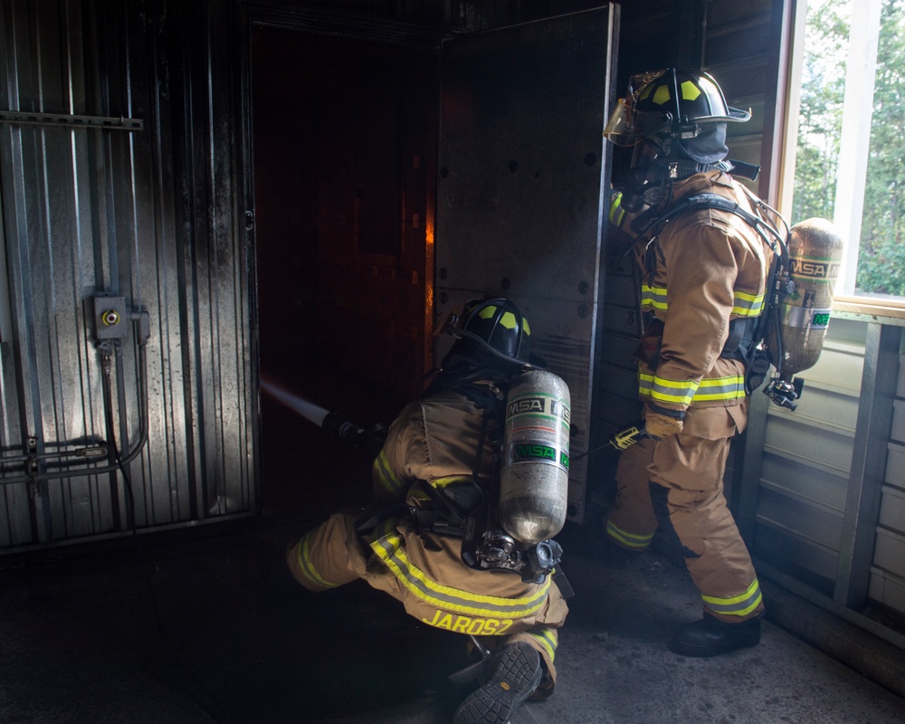 Air Force firefighters conduct wartime-firefighting readiness training at JBER Air Force firefighters conduct wartime-firefighting readiness training at JBER