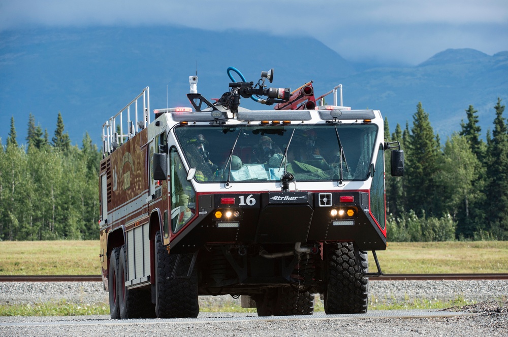 Air Force firefighters conduct wartime-firefighting readiness training at JBER Air Force firefighters conduct wartime-firefighting readiness training at JBER