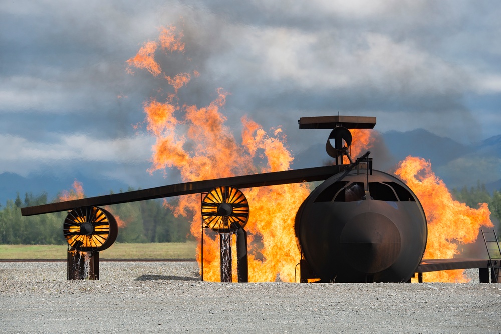 Air Force firefighters conduct wartime-firefighting readiness training at JBER Air Force firefighters conduct wartime-firefighting readiness training at JBER