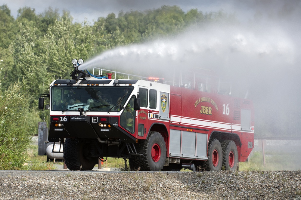 Air Force firefighters conduct wartime-firefighting readiness training at JBER Air Force firefighters conduct wartime-firefighting readiness training at JBER