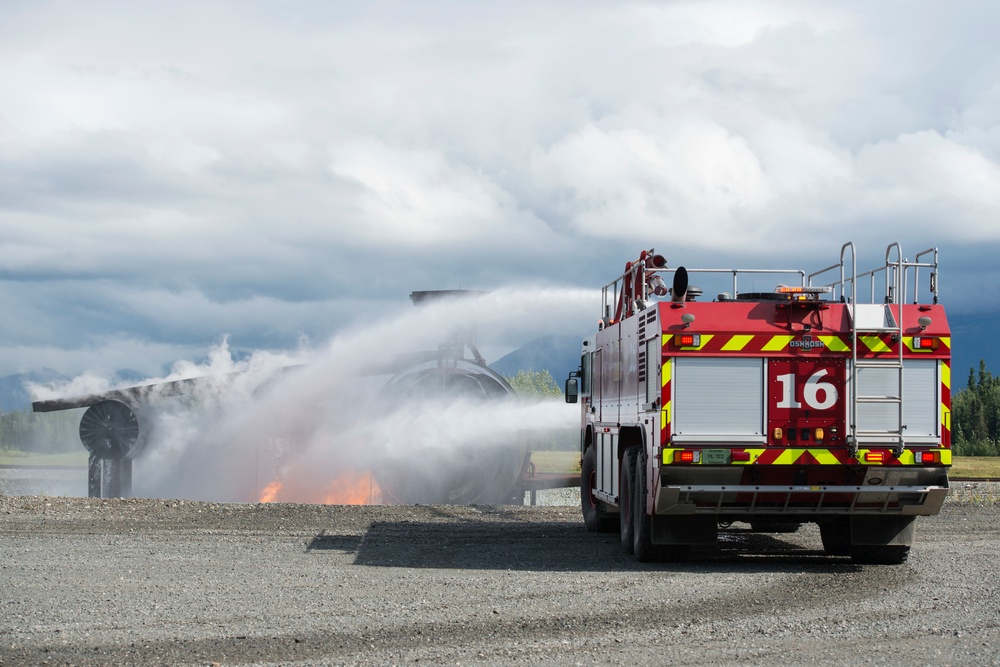 Air Force firefighters conduct wartime-firefighting readiness training at JBER Air Force firefighters conduct wartime-firefighting readiness training at JBER
