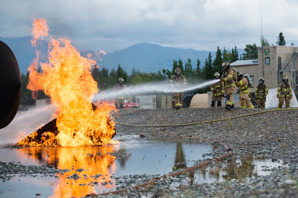 Air Force firefighters conduct wartime-firefighting readiness training at JBER Air Force firefighters conduct wartime-firefighting readiness training at JBER
