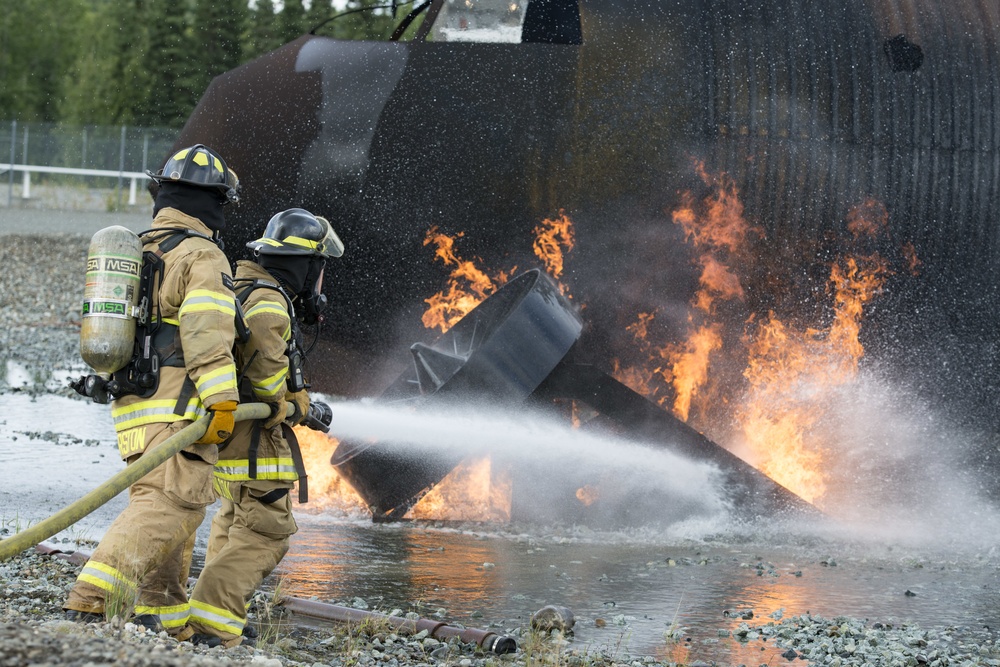 Air Force firefighters conduct wartime-firefighting readiness training at JBER Air Force firefighters conduct wartime-firefighting readiness training at JBER