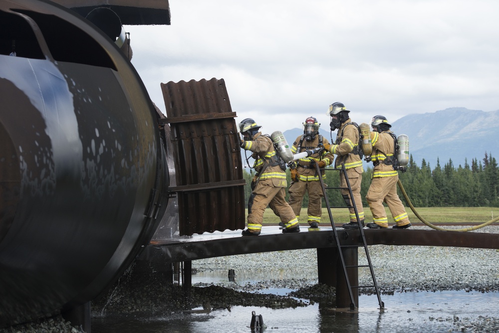Air Force firefighters conduct wartime-firefighting readiness training at JBER Air Force firefighters conduct wartime-firefighting readiness training at JBER