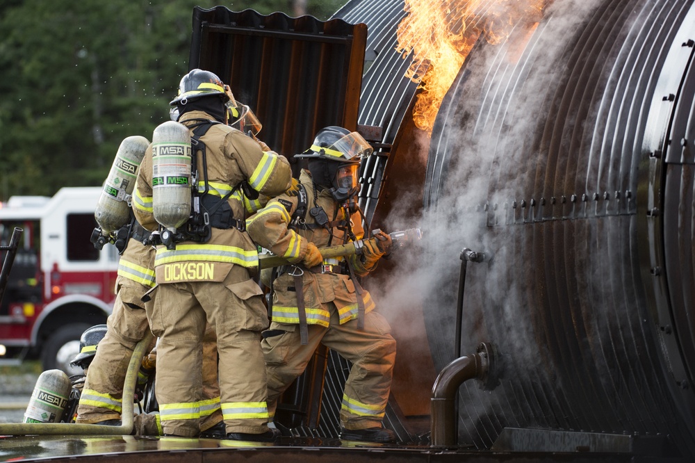 Air Force firefighters conduct wartime-firefighting readiness training at JBER Air Force firefighters conduct wartime-firefighting readiness training at JBER