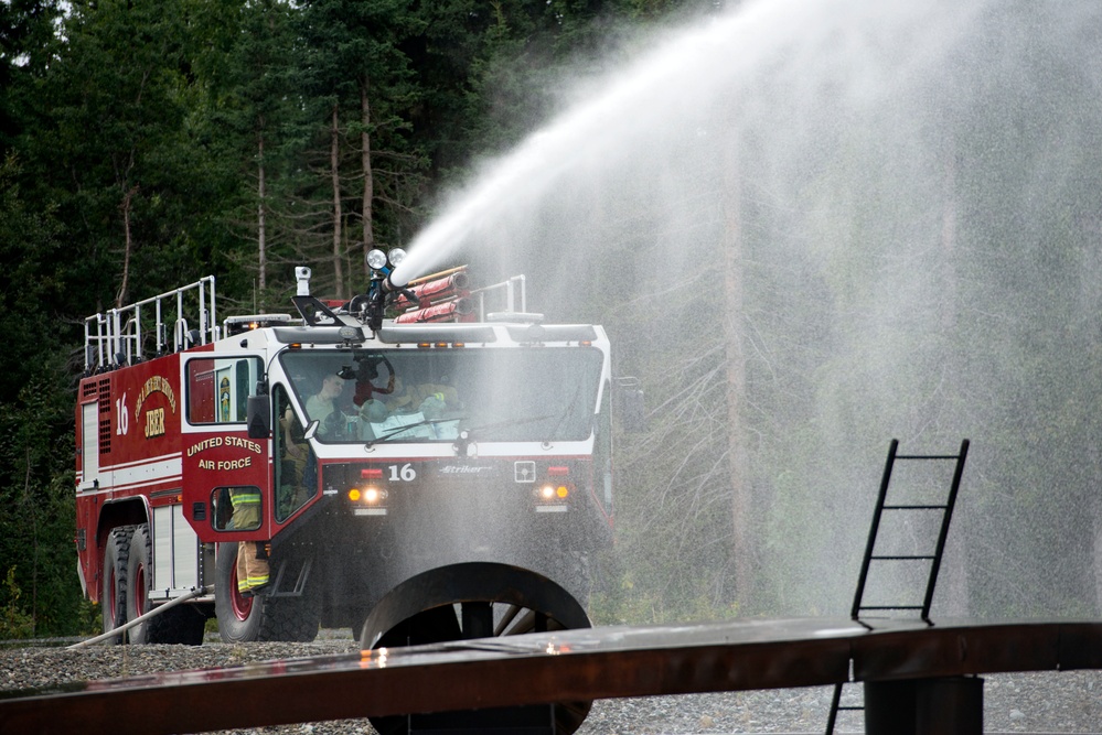 Air Force firefighters conduct wartime-firefighting readiness training at JBER Air Force firefighters conduct wartime-firefighting readiness training at JBER