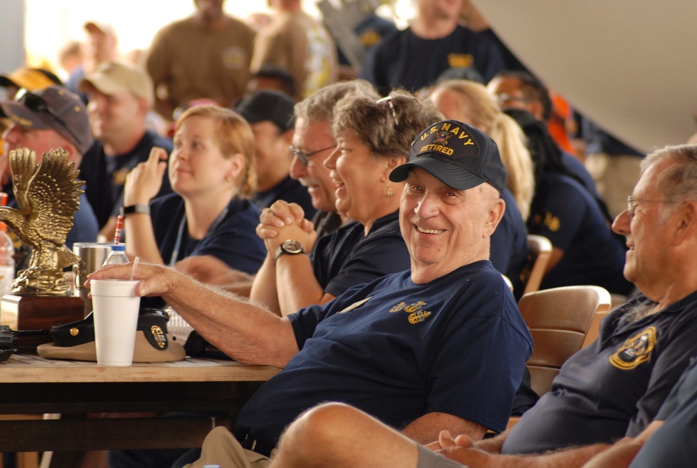 Volunteer enjoys a front row seat during cadence and guidon competition