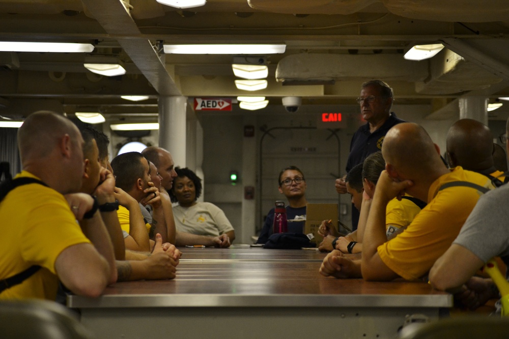 Master Chief Petty Officer of the Navy (Ret.) Duane Bushey speaks to CPO Selectees aboard the USS Wisconsin (BB-64)