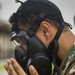 Soldier dons mask before gas chamber
