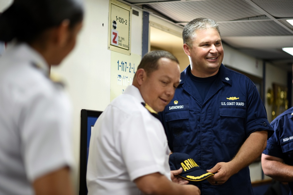 Coast Guard Cutter Tahoma's commanding officer is presented a gift by Colombian naval officials in spirit of UNITAS exercise