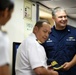 Coast Guard Cutter Tahoma's commanding officer is presented a gift by Colombian naval officials in spirit of UNITAS exercise