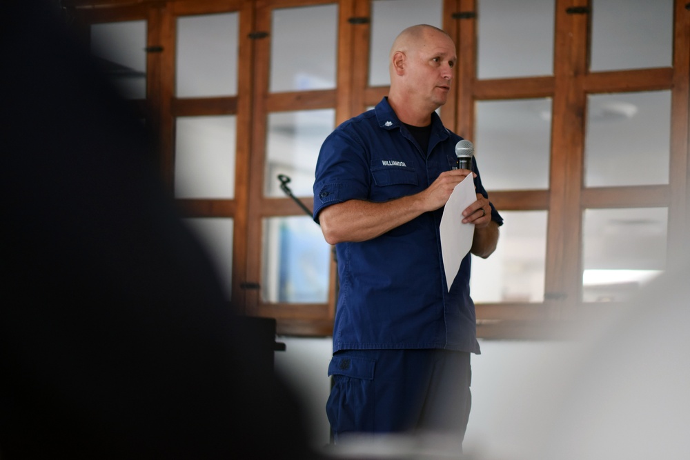 A Coast Guard commander gives a maritime interdiction and operations presentation during UNITAS 2018
