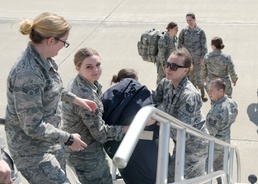 Airmen load bags onto KC-135 Stratotanker
