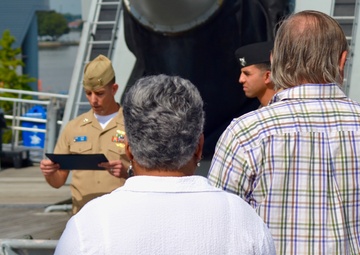 Naval Museum hosts a re-enlistment ceremony aboard the USS Wisconsin (BB-64)