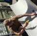 UCT 2 CDD/C prepares new pile jackets as part of repairs to the Harbor Master Pier in Yokosuka, Japan.