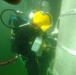 UCT 2 CDD/C prepares new pile jackets as part of repairs to the Harbor Master Pier in Yokosuka, Japan.