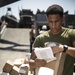 Marines and Sailors receive food supplies and mail during a replenishment-at-sea