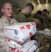 Marines and Sailors receive food supplies and mail during a replenishment-at-sea