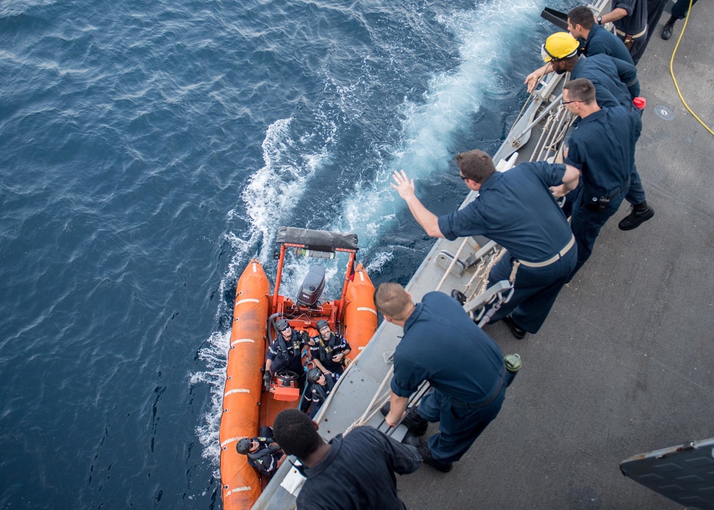 USS Jason Dunham Sailors exchange gifts with French auxillary ship Dupuy De Lome sailors after coducting escort