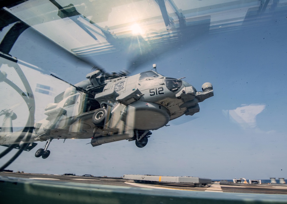 Sailor performs machine gun maintenance on USS Jason Dunham (DDG 109)