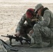 Air National Guardsman receives training on adjusting his weapon site during weapons qualifications for deployment