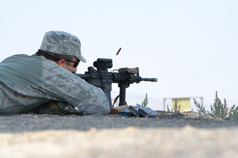 A Security Forces member from the 152nd Security Forces Squadron, Nevada Air National Guard, fires a round at his target during conducting weapons qualifications