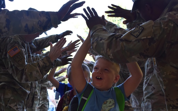 Haircuts and high fives: 20th CBRNE Soldiers welcome area elementary school students back to class