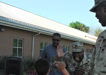 Haircuts and high fives: 20th CBRNE Soldiers welcome area elementary school students back to class
