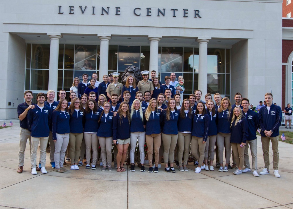 Marines Congratulate Queen's University Swim Team