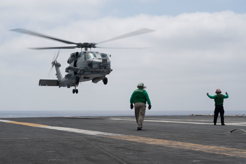 An MH-60R Sea Hawk, with Helicopter Maritime Strike Squadron (HSM) 71, prepares to land on the flight deck aboard the Nimitz-class aircraft carrier USS John C. Stennis (CVN 74).