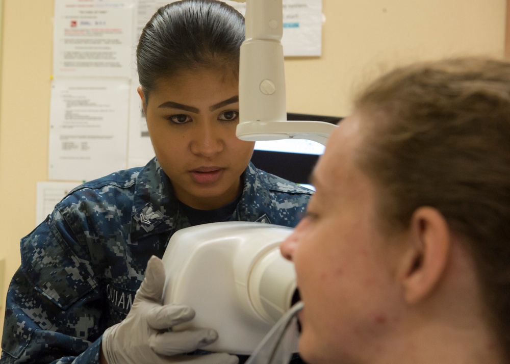 Sailor Performs Physical Health Assessment