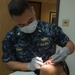 Sailor Performs Physical Health Assessment