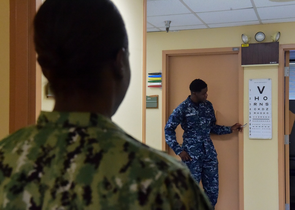 Sailor Performs Physical Health Assessment