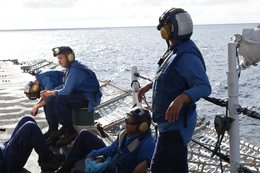 Coast Guard Cutter Tahoma helicopter tie-down members prepare for flight operations during UNITAS 2018