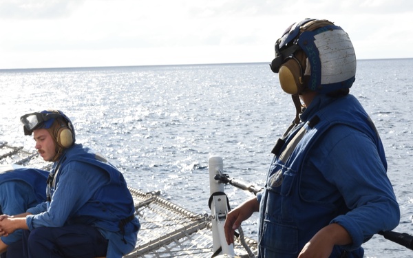 Coast Guard Cutter Tahoma helicopter tie-down members prepare for flight operations during UNITAS 2018