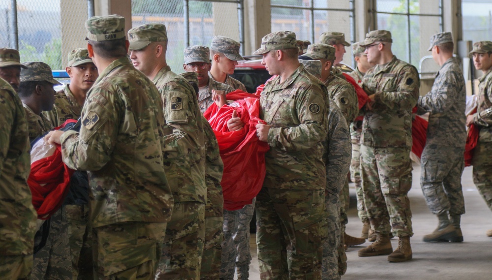 Maryland National Guard Soldiers and Airmen display flag at Baltimore Ravens Game