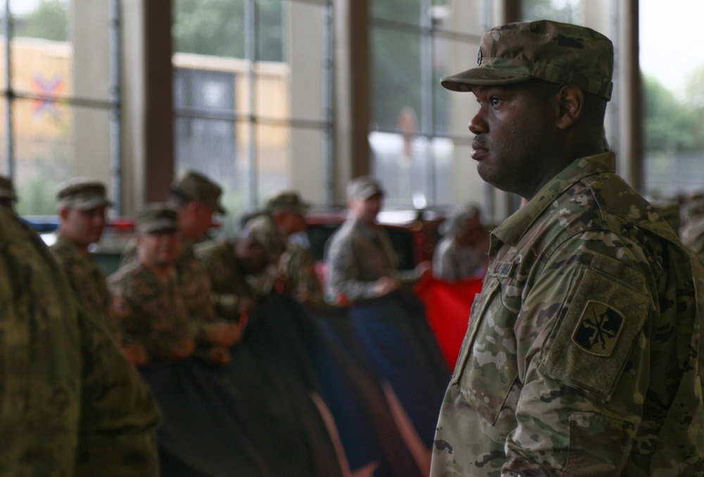 Maryland National Guard Soldiers and Airmen display flag at Baltimore Ravens Game