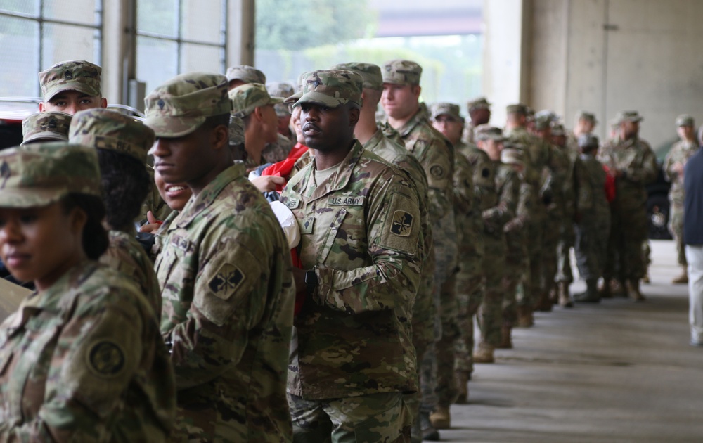 Maryland National Guard Soldiers and Airmen display flag at Baltimore Ravens Game