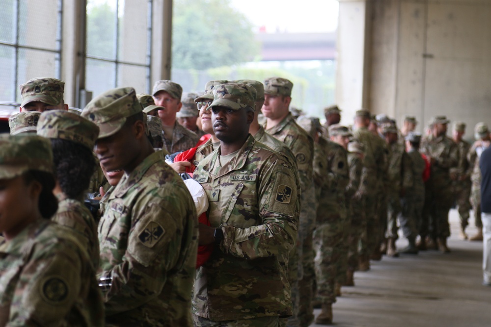 Maryland National Guard Soldiers and Airmen display flag at Baltimore Ravens Game