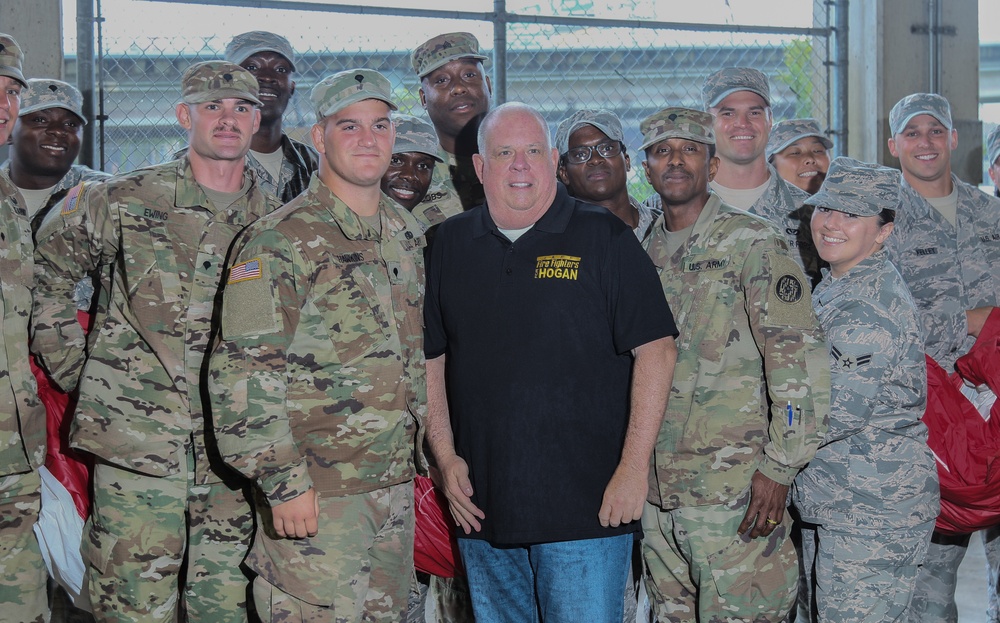 Maryland National Guard Soldiers and Airmen display flag at Baltimore Ravens Game