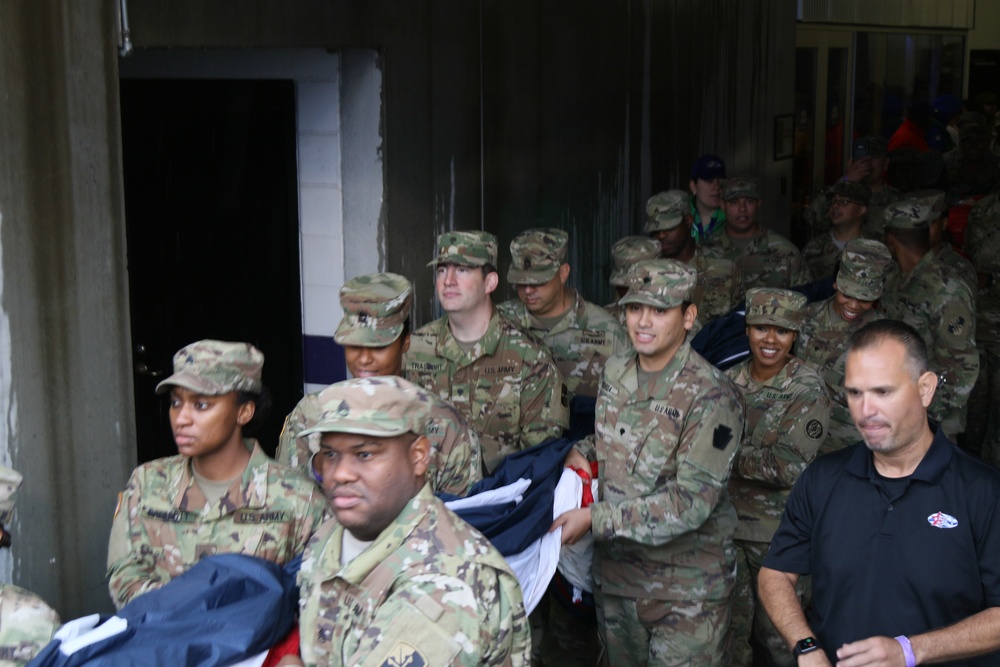 Maryland National Guard Soldiers and Airmen display flag at Baltimore Ravens Game