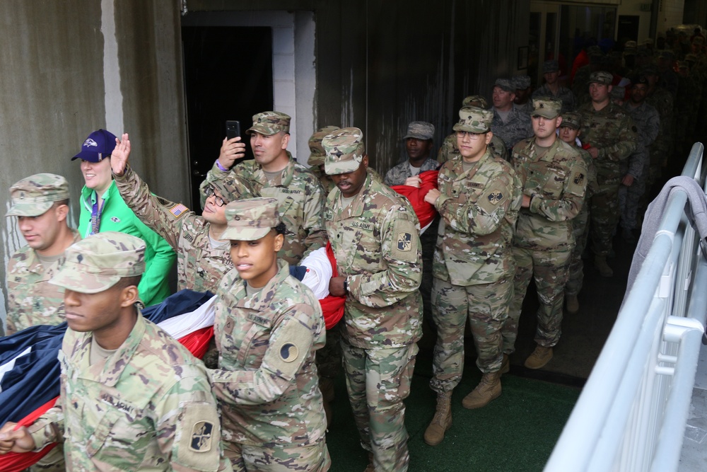 Maryland National Guard Soldiers and Airmen display flag at Baltimore Ravens Game