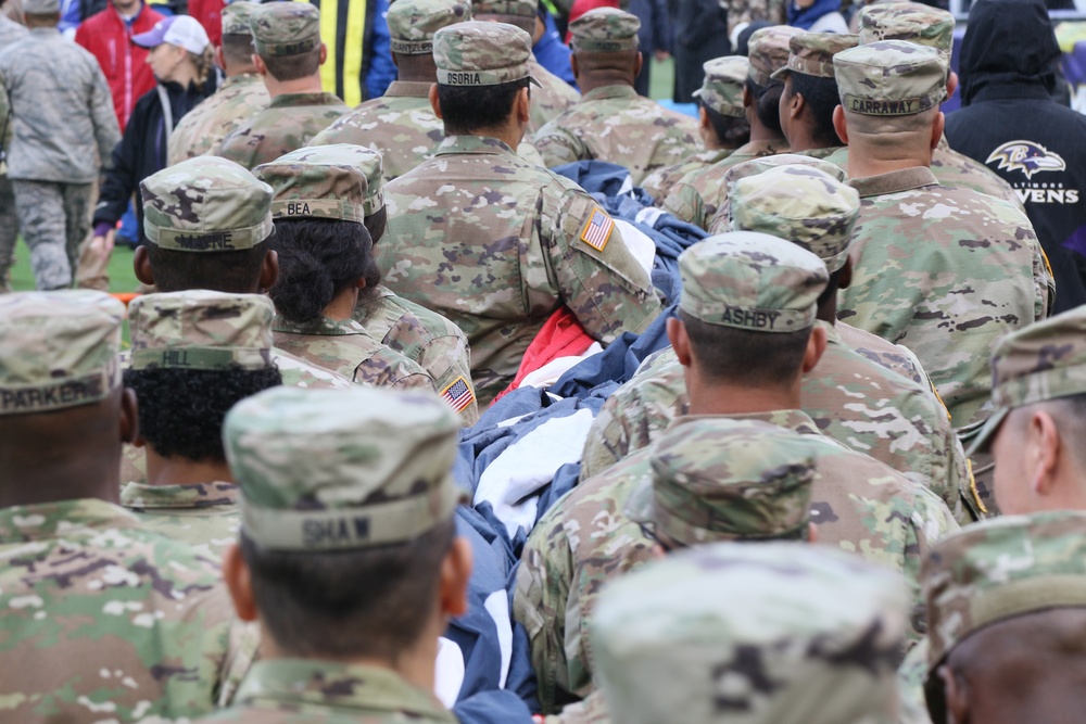 Maryland National Guard Soldiers and Airmen display flag at Baltimore Ravens Game