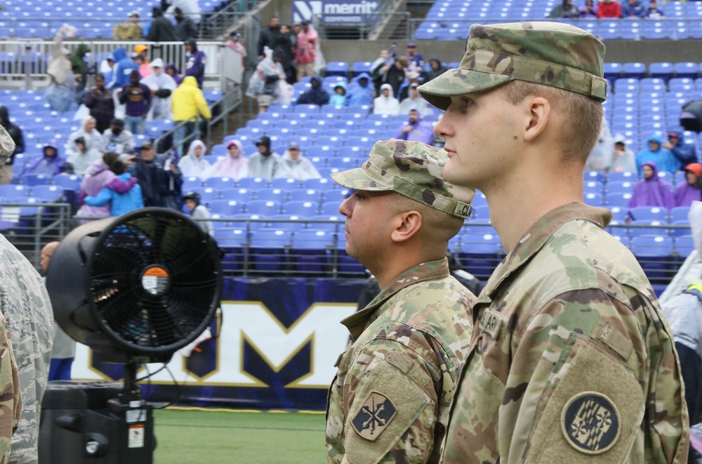 Maryland National Guard Soldiers and Airmen display flag at Baltimore Ravens Game