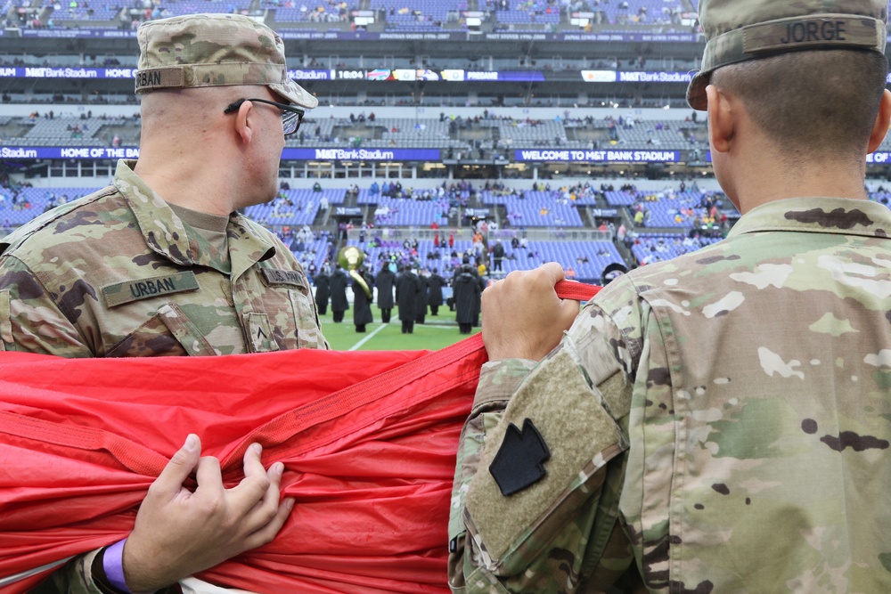 Maryland National Guard Soldiers and Airmen display flag at Baltimore Ravens Game