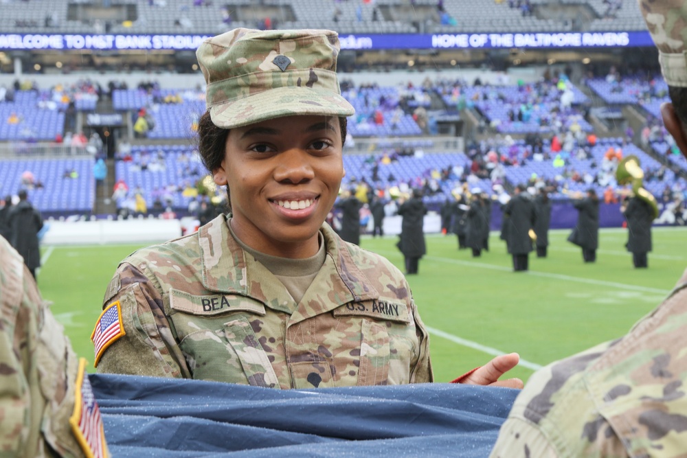 Maryland National Guard Soldiers and Airmen display flag at Baltimore Ravens Game