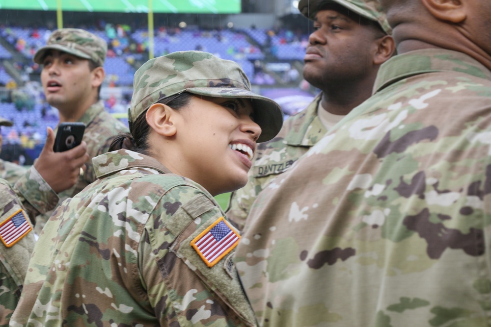 Maryland National Guard Soldiers and Airmen display flag at Baltimore Ravens Game